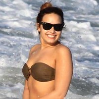Demi Lovato caught in the sea surf