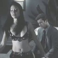 Lucy Liu posing in sexy outfit in Payback movie