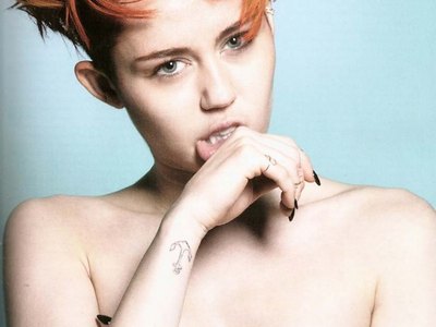 Provoking photo shoot of sexy Miley Cyrus and her slipping nipples!