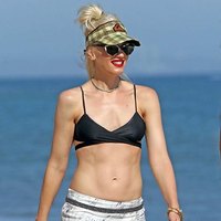 Gwen Stefani posing on a beach